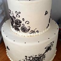 Henna, yoga, guitar design wedding cake