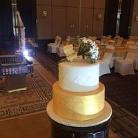 Wedding cake with a bouquet of jasmine flower