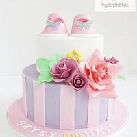 Baby girl booties & sugar flowers cake