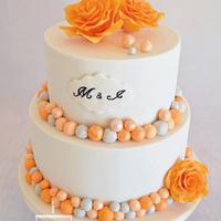Wedding cake in white/orange/grey with roses