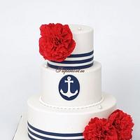 Navy themed wedding cake with red peonies