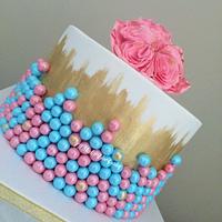 pink, blue and gold cake