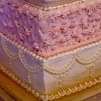 Square pink and gold buttercream wedding cake