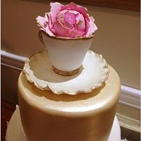 Vintage blush and gold luster wedding cake 