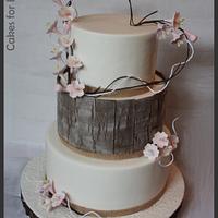 Blossom wedding cake with wood panels