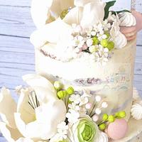 Naked cake with large magnolia gumpaste flower