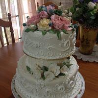 Wedding cake with fondant flowers and scrolls