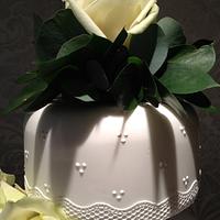 White lace and rose wedding cake