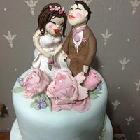 tiffany green and dusty rose wedding couple cake