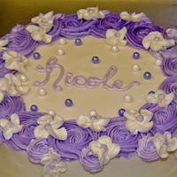 Purple rosette and white floral cake