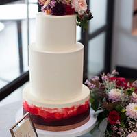 Buttercream cake with deep red watercolour