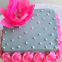 A square cake with gorgeous cake...
