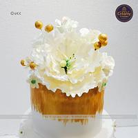 Golden glittered wedding cake