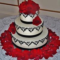 Dramatic Buttercream wedding cake in black and red!