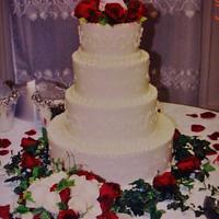 Round red rose buttercream wedding cake