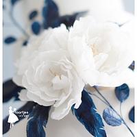 Blue waterpaper feathers and white peonies