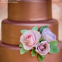 Rose gold 4 tier cake with sugar roses