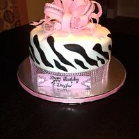 Pink and white zebra print birthday cake