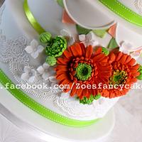 Bright orange and green detailed wedding cake