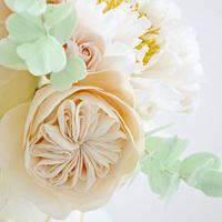 Cream wedding cake with sugar flowers