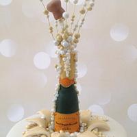 Popping champagne corks 60th birthday cake