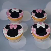 Minnie mouse cake and Cupcakes.