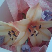 cold porcelain orange lilies with purple freesia flowers