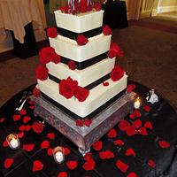 Red and black wedding cake in buttercream 