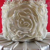 Silver ruffles, pleats and bling wedding cake