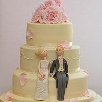 Wedding cake with bride and groom toppers