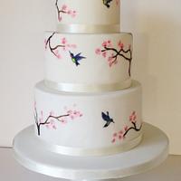 Handpainted hummingbirds and cherry blossom cake
