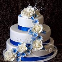  Blue and white roses and frangipanni cake