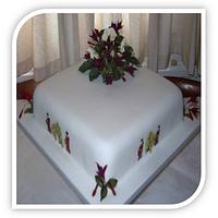 Fuschias and cream roses on an Oriental inspired wedding cake