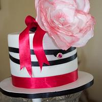 Elza pink and black cake with rice flowers 