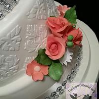 An Ivory and Coral Damask Wedding Cake