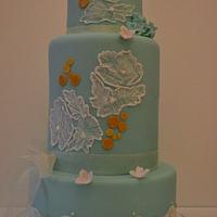 Ice blue & antique gold wedding cake