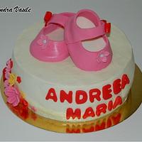 Pink baby shoes cake