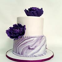 Purple peonies and marble effect wedding cake