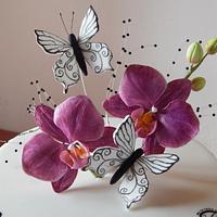 Hand painted magenta orchid and butterfly cake.