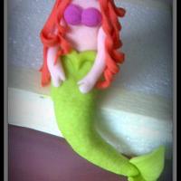 Mermaid-themed cake topper