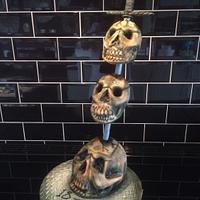 Three Impaled Skulls