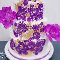 Purple and gold lace wedding cake 