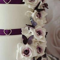 Purple butterflies and rose wedding cake