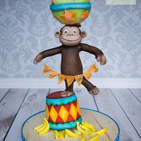 Curious George cake circus balance cake