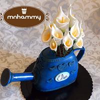 Watering can with calla lillys