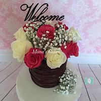 Chocolate naked cake with fresh flowers 