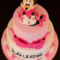 It's pink and ... has a pretty bow!......Polka Dot & Pink Minnie Mouse First Birthday Cake 
