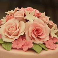 Vintage wedding cake with roses and lace
