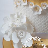 gold cup and saucer primose flowers cake