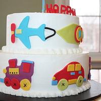 car, train and plane cake